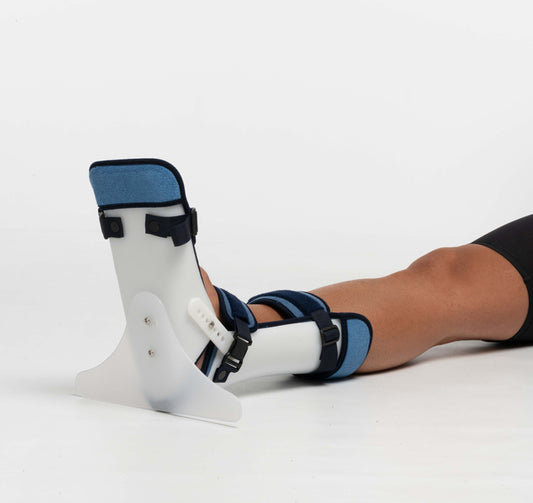Attelle de positionnement du pied-cheville et éventuellement hanche