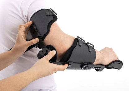 Attelle de coude articulée avec orthèse de main au repos