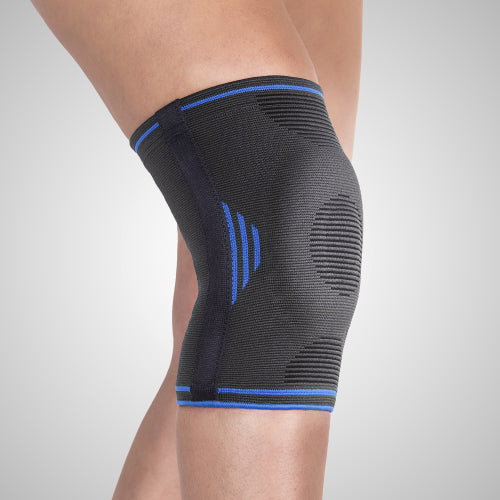 Genouillère élastique avec stabilisateurs latéraux souples et centrage rotulien pour le sport