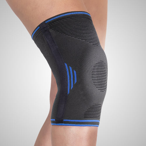 Genouillère élastique avec stabilisateurs latéraux souples et centrage rotulien pour le sport