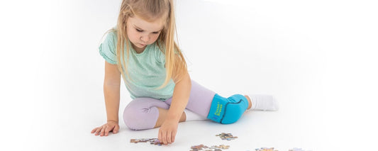 Genouillère de maintien et protection pédiatrique couleur aléatoire